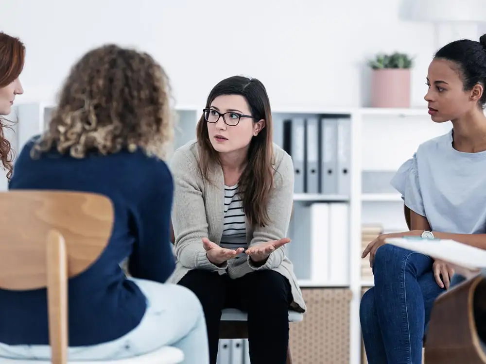 people during group therapy outpatient care